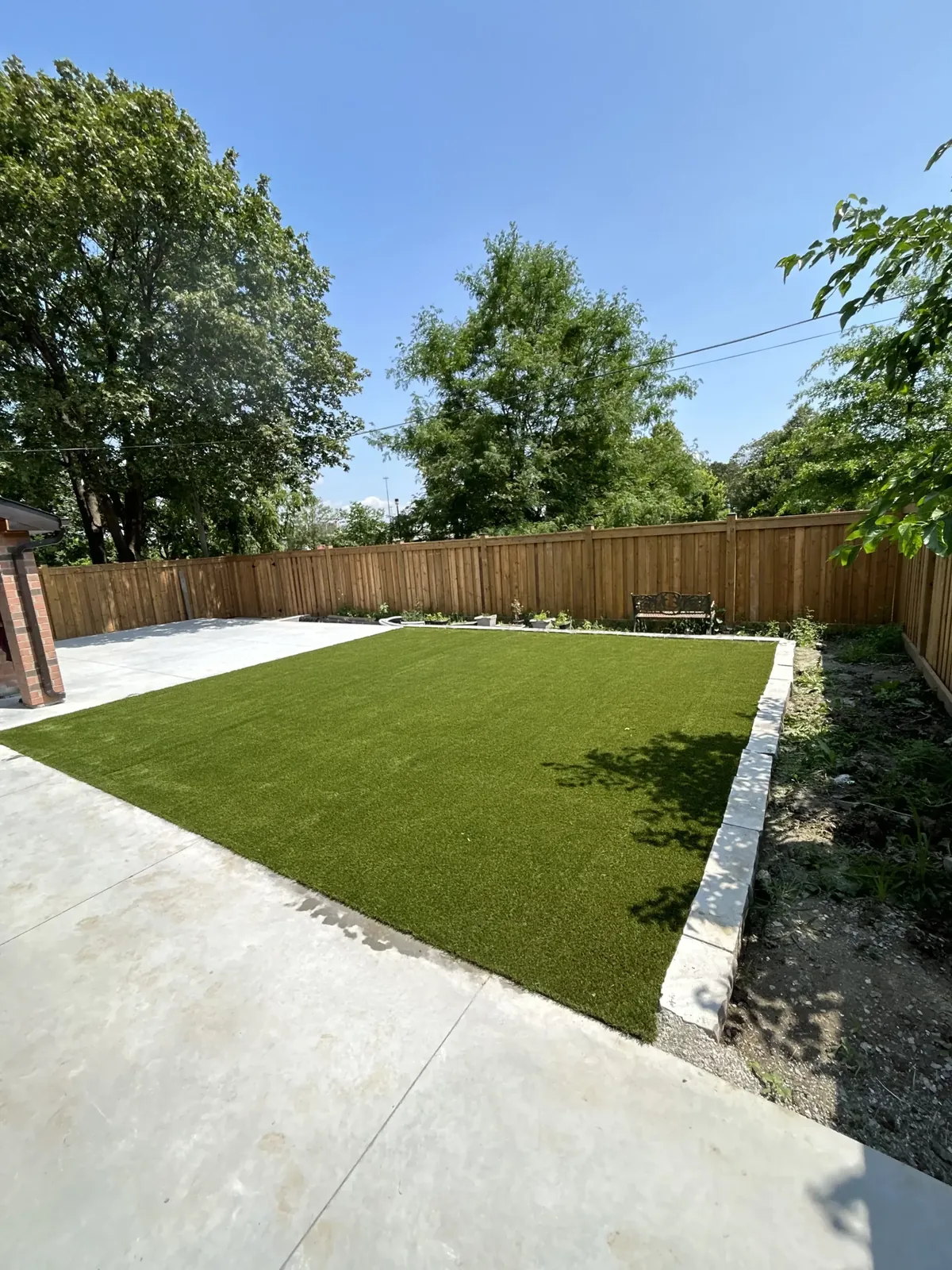 Artificial grass side yard installation