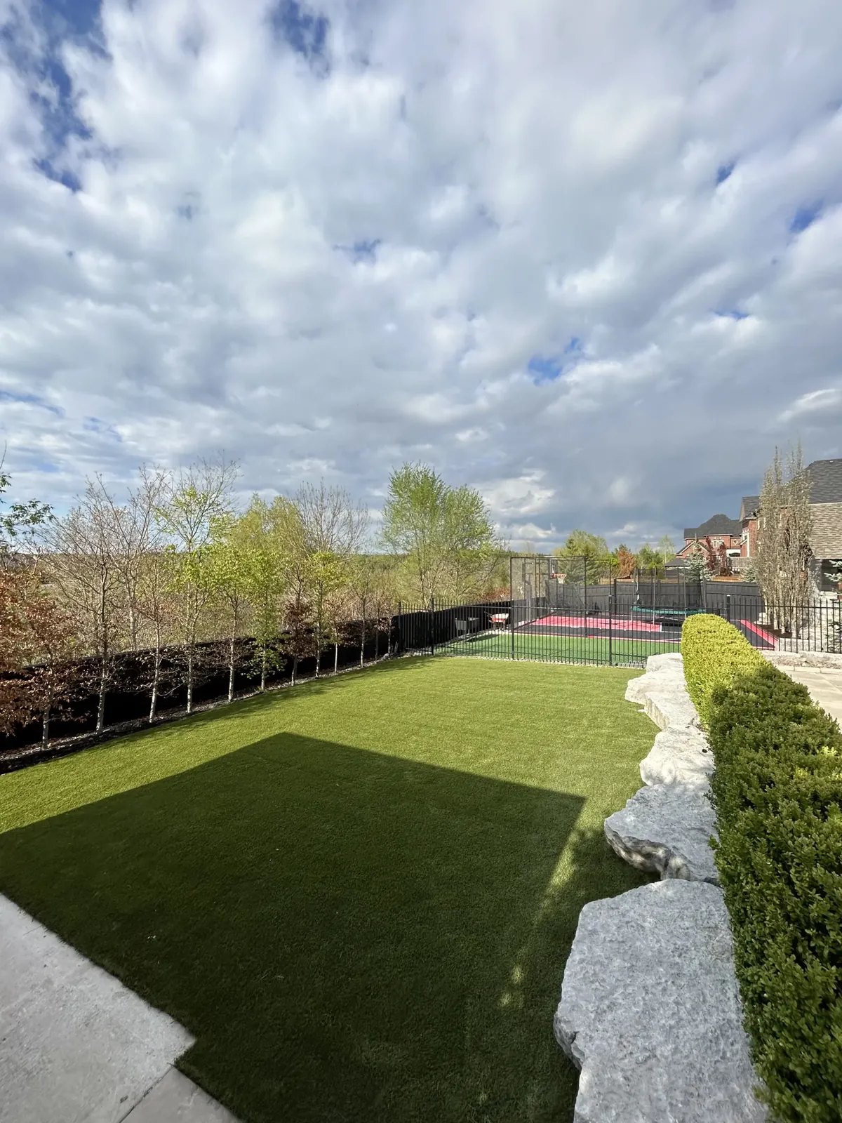 Backyard artificial grass installation in Aurora